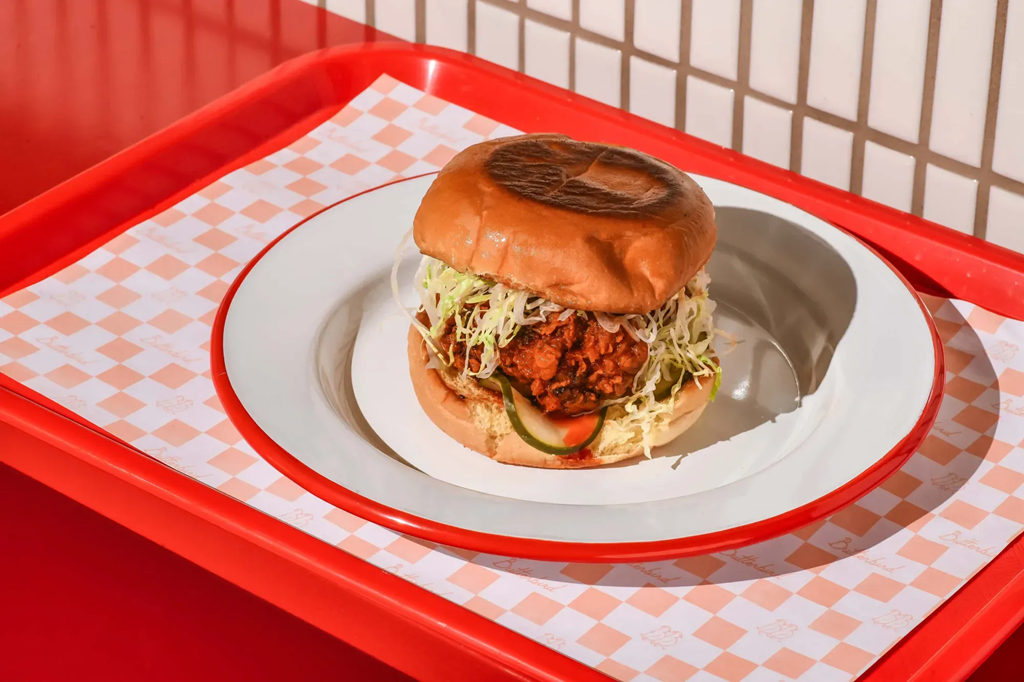 Classic breaded chicken sandwich on a red tray.