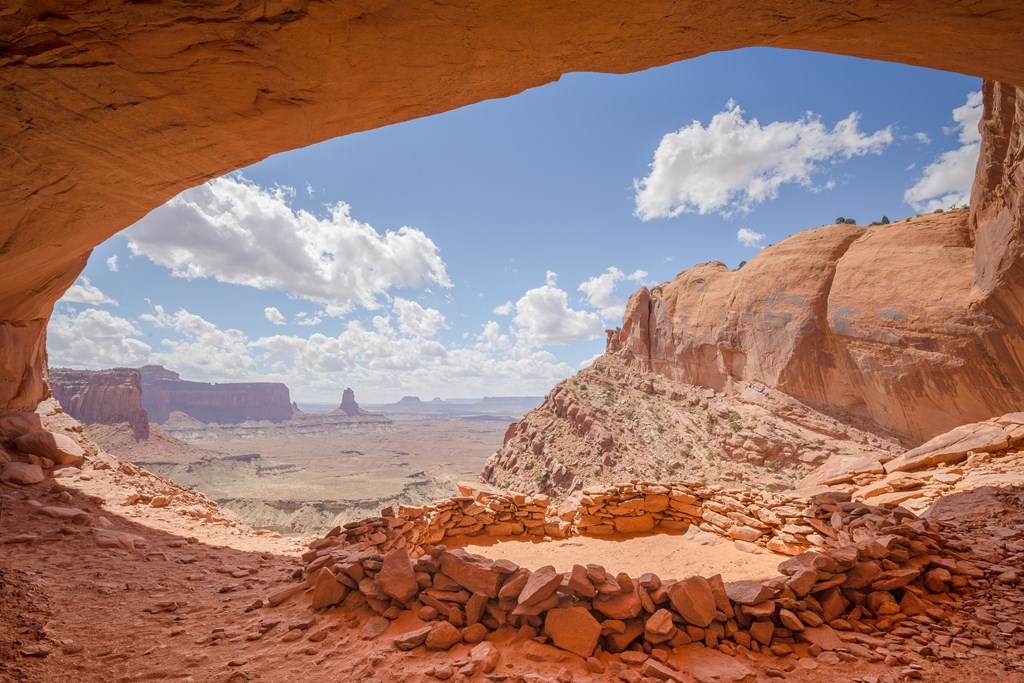 An old circle of sandstone known as False Kiva sits high above the valley floor of Canyonlands National Park.