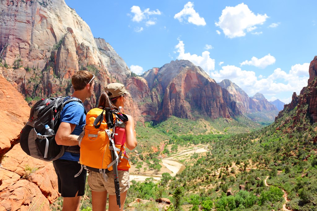 A couple hiking and looking at the view near Angles Landing, Zion Canyon